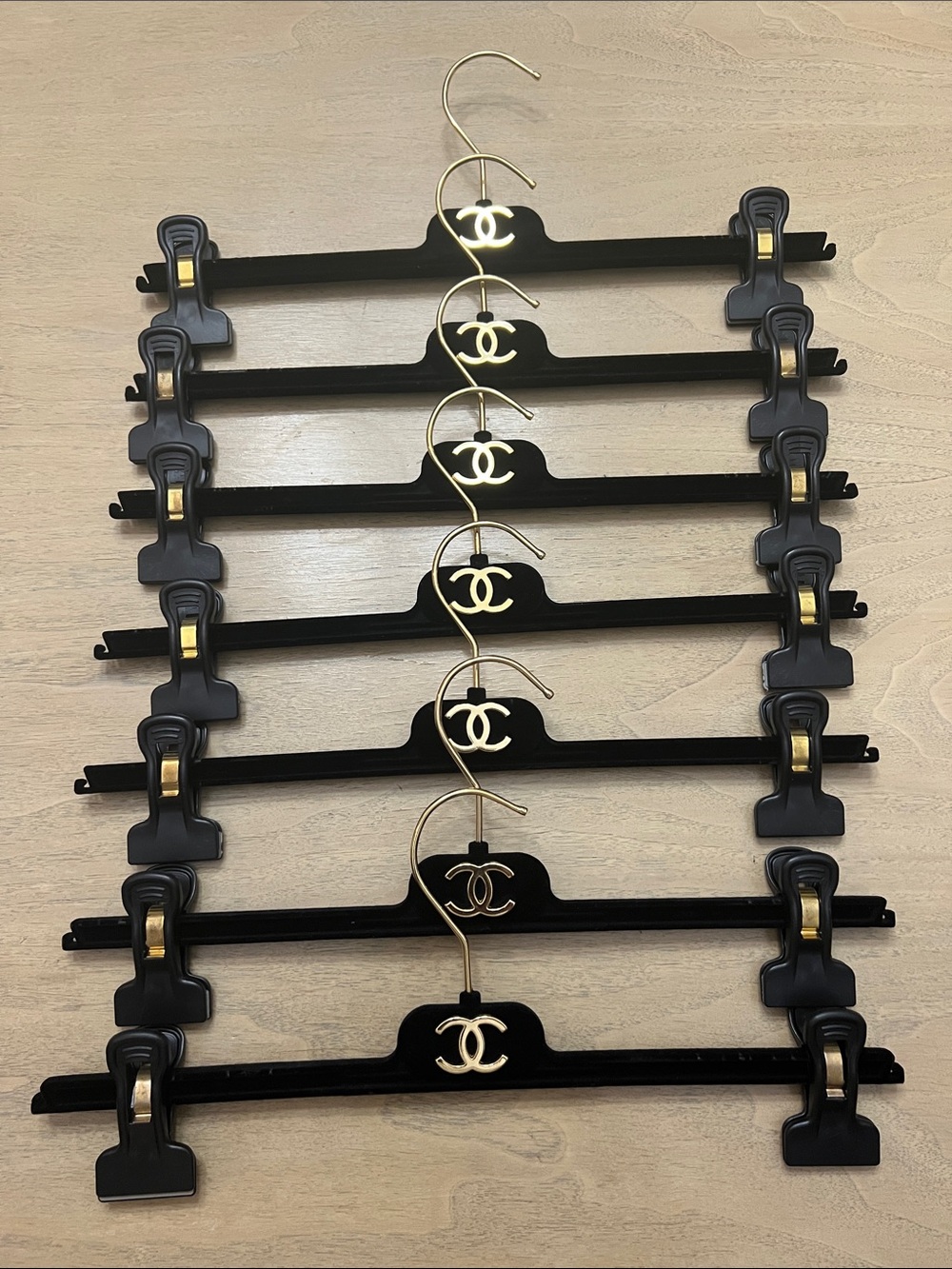 CHANEL Black and Gold Logo Pant Hangers - Set of 8
